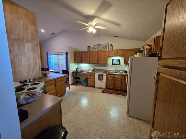 kitchen featuring ceiling fan, white appliances, a textured ceiling, and vaulted ceiling