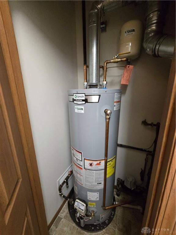 utility room with water heater