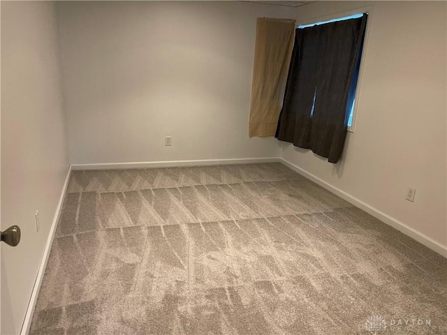 unfurnished room with carpet flooring