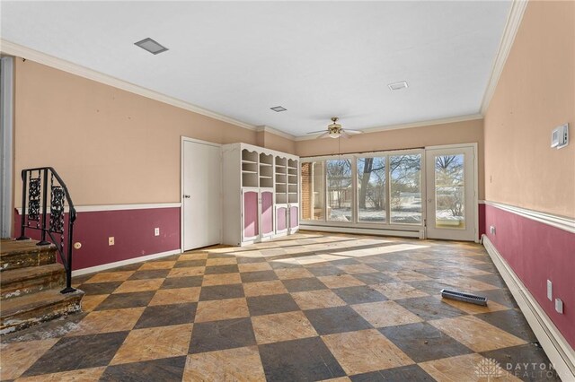 interior space featuring ceiling fan and ornamental molding