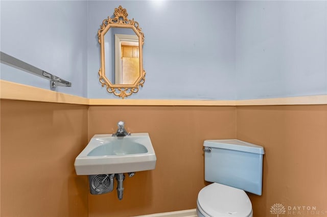 bathroom with toilet and sink