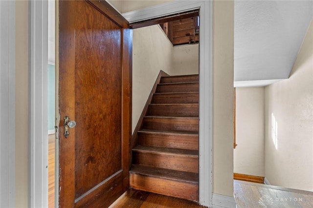 stairway featuring hardwood / wood-style floors