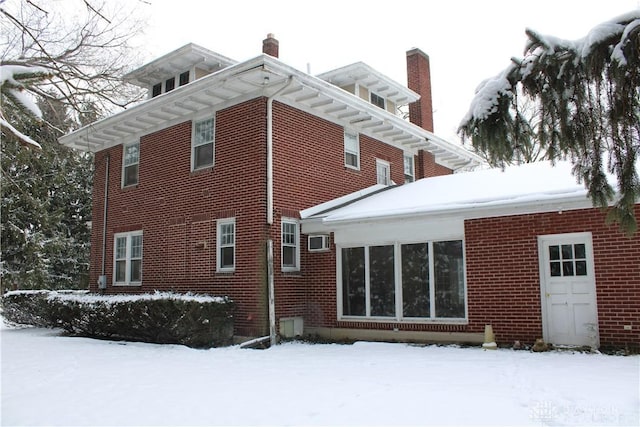 view of snow covered house