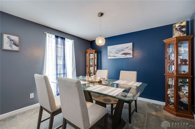 view of carpeted dining area