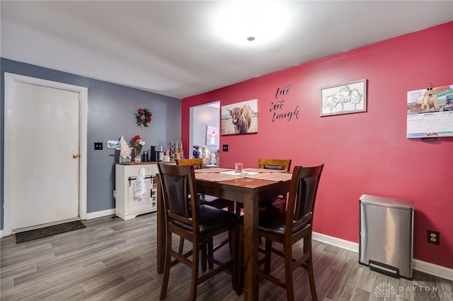 dining space featuring hardwood / wood-style floors