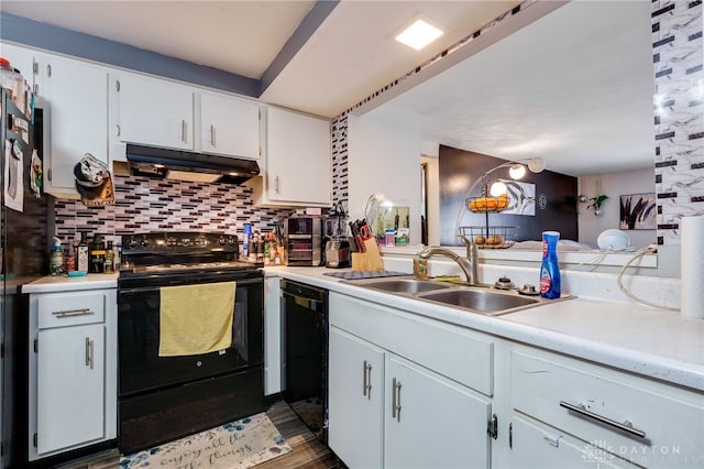 kitchen featuring backsplash, white cabinets, sink, and black appliances