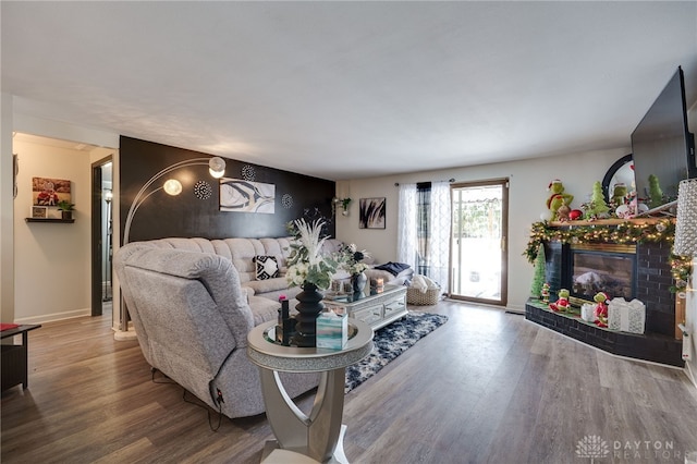 living room with hardwood / wood-style floors and a fireplace