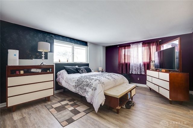 bedroom with wood-type flooring