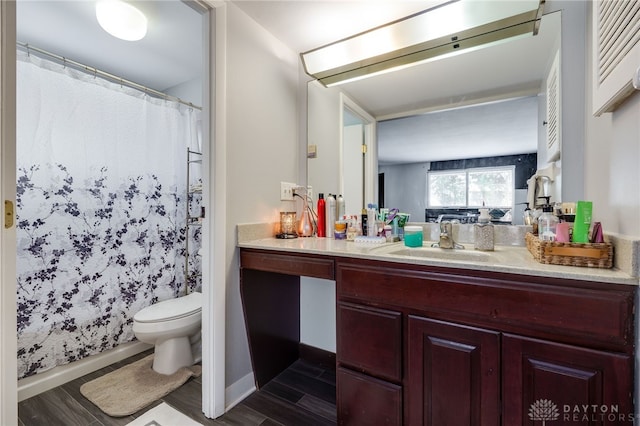 bathroom with vanity, hardwood / wood-style flooring, toilet, and a shower with shower curtain