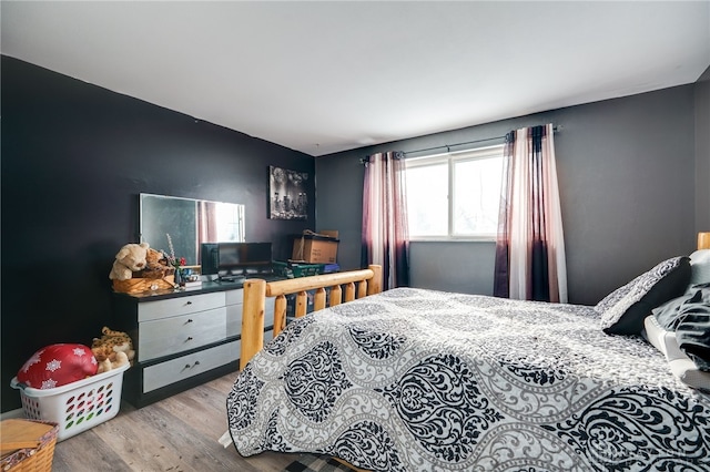 bedroom with light hardwood / wood-style flooring