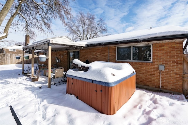 exterior space with a hot tub