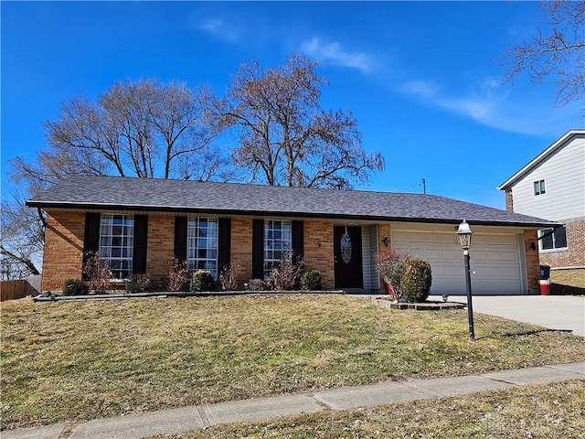 ranch-style home with a garage and a front yard