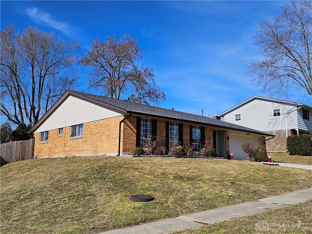 view of front facade featuring a garage and a front yard