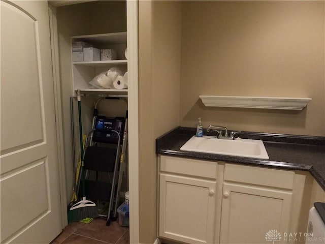 bathroom featuring tile patterned floors, vanity, and toilet