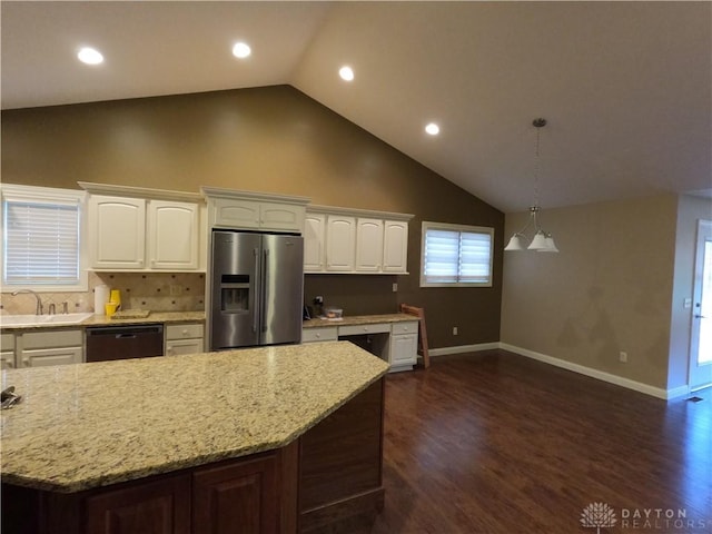 kitchen with white cabinets, pendant lighting, stainless steel fridge with ice dispenser, and black dishwasher