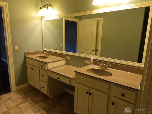 bathroom with tile patterned flooring, vanity, and ornamental molding