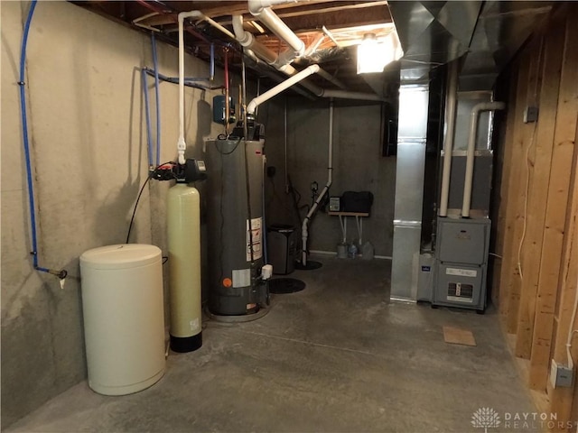 utility room with heating unit and water heater