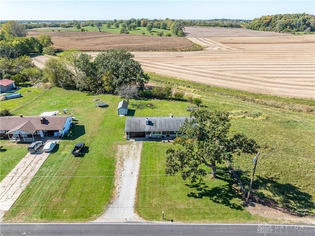 birds eye view of property with a rural view