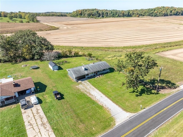 birds eye view of property with a rural view