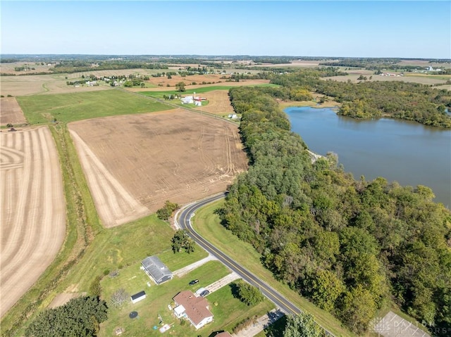 drone / aerial view with a rural view and a water view