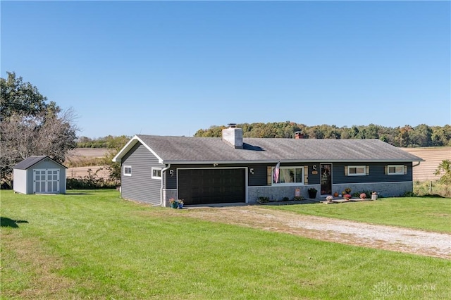 ranch-style home with a front yard, driveway, a chimney, a storage unit, and a garage