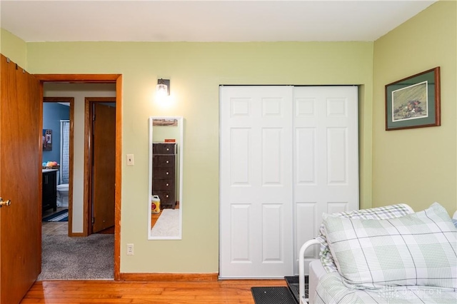 bedroom with a closet and light wood-style floors