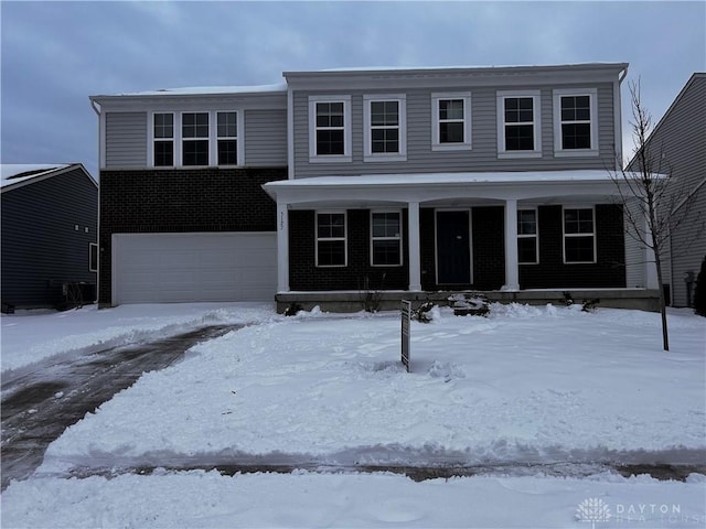 front of property with a garage and covered porch