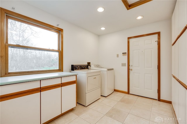 laundry room featuring light tile patterned floors and independent washer and dryer