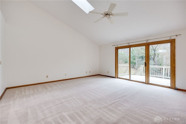 spare room featuring light carpet, high vaulted ceiling, and ceiling fan