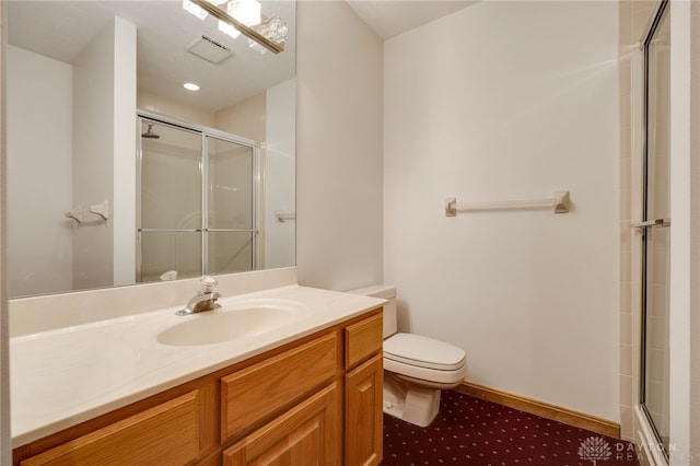 bathroom featuring vanity, toilet, and walk in shower