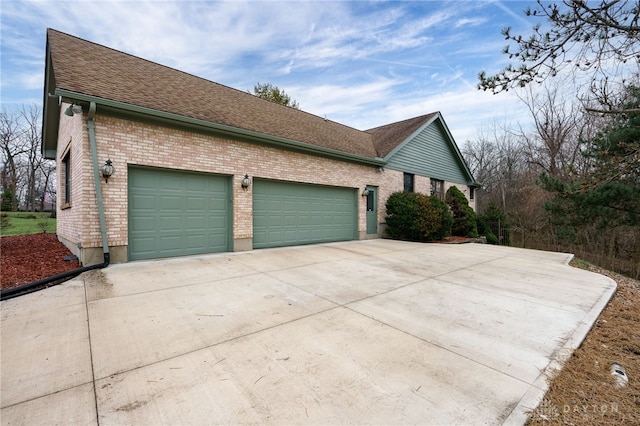 view of side of property featuring a garage