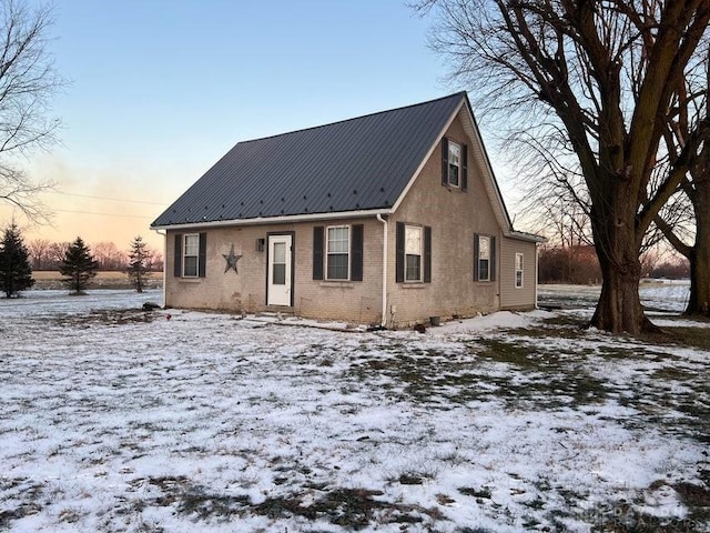 view of snow covered house