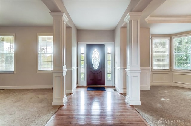 view of carpeted foyer entrance