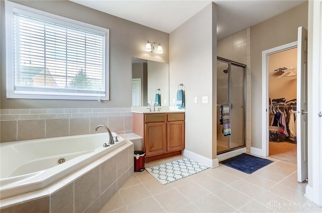 bathroom featuring separate shower and tub, tile patterned flooring, and vanity