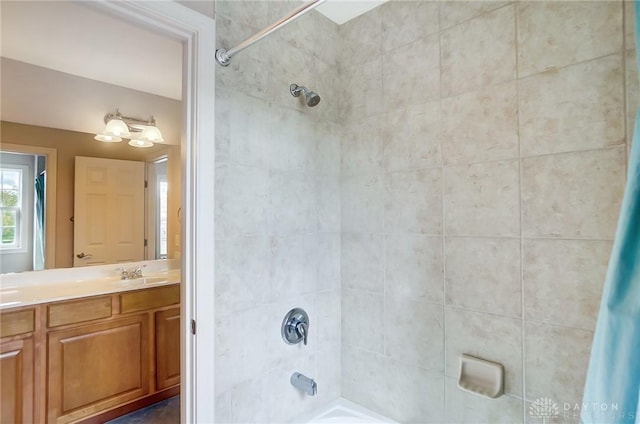 bathroom featuring vanity and shower / tub combo