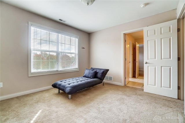 living area with light carpet