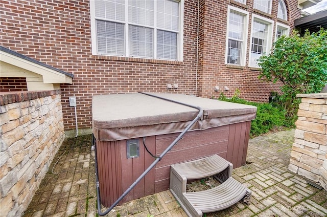 view of patio with a hot tub