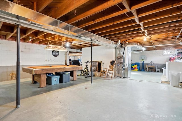 basement featuring heating unit and independent washer and dryer