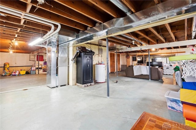 basement featuring heating unit and gas water heater