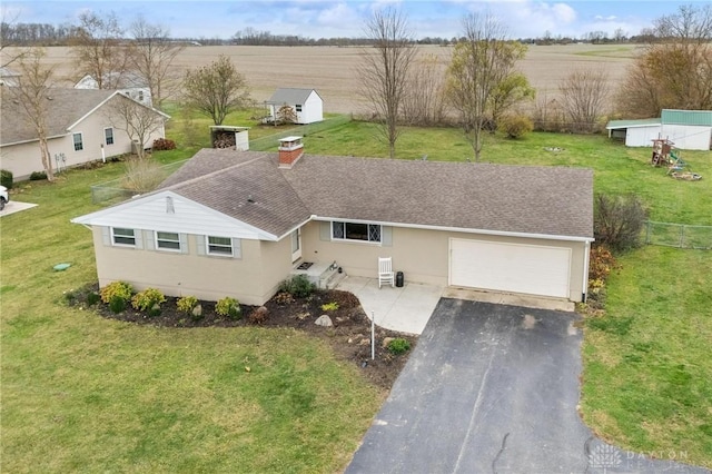 birds eye view of property featuring a rural view