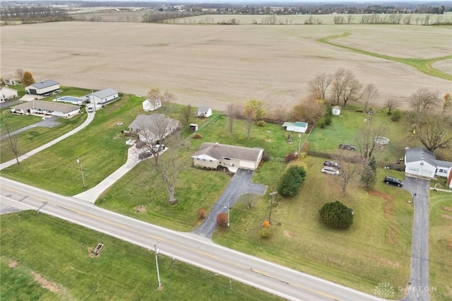 birds eye view of property with a rural view