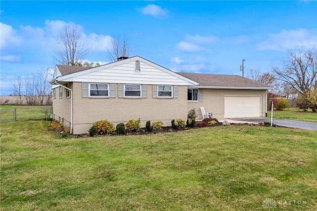 single story home featuring a front yard and a garage