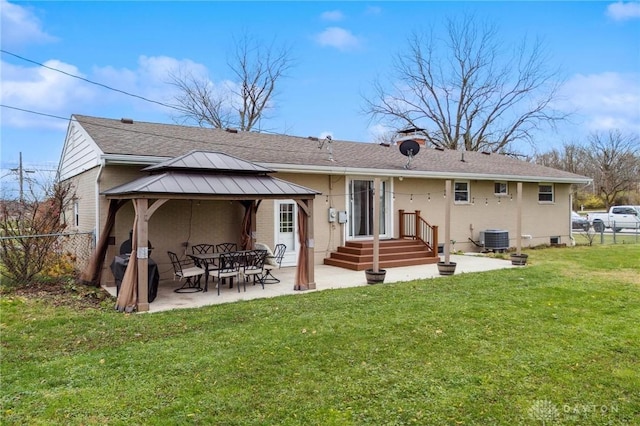 back of property featuring a gazebo, central AC unit, a patio area, and a lawn