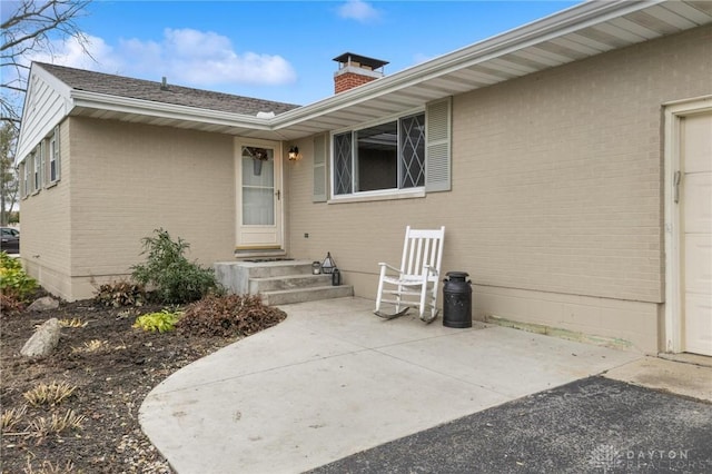 doorway to property with a patio