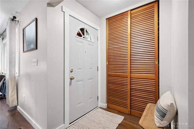 foyer with dark hardwood / wood-style floors