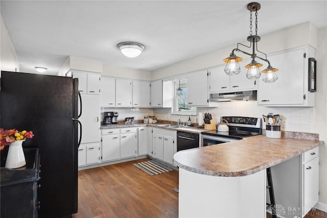 kitchen with kitchen peninsula, black appliances, white cabinets, dark hardwood / wood-style floors, and hanging light fixtures