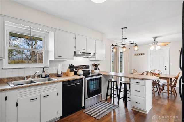 kitchen with electric stove, sink, pendant lighting, dishwasher, and white cabinets