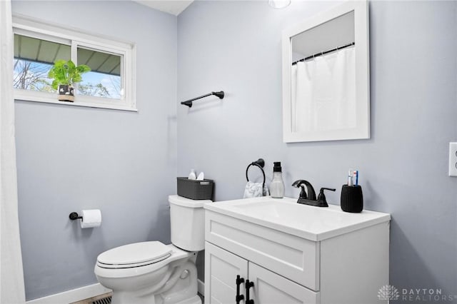 bathroom featuring vanity and toilet