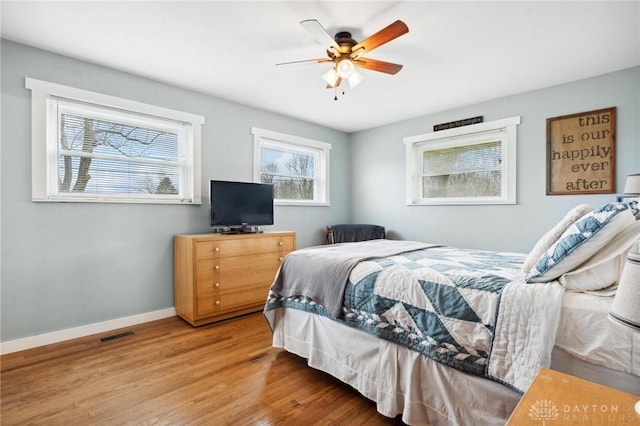 bedroom with hardwood / wood-style flooring and ceiling fan