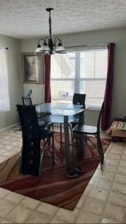 dining space featuring a chandelier